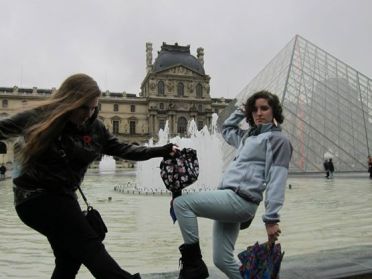 Vogue-ing outside the Louvre.